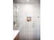 Elegant glass shower with tiled walls and built-in niche at 1930 Grove St # 2, Denver, CO 80204