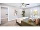 Bright bedroom featuring a ceiling fan, balcony access, and modern decor at 1930 Grove St # 2, Denver, CO 80204