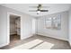 Inviting bedroom with a walk-in closet and window at 1930 Grove St # 2, Denver, CO 80204