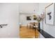 Stylish dining area with modern lighting, wood floors, and elegant decor creating an inviting space at 1930 Grove St # 2, Denver, CO 80204