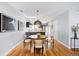Dining area with modern lighting and decor, seamlessly connected to the open-concept living spaces at 1930 Grove St # 2, Denver, CO 80204