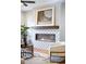 Living room featuring a modern fireplace with decorative tile and mantle, providing warmth and style at 1930 Grove St # 2, Denver, CO 80204