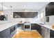 Contemporary kitchen featuring a large island, modern appliances, and ample counter space at 1930 Grove St # 2, Denver, CO 80204