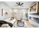 Bright living room featuring a fireplace, modern furnishings, and access to the outside at 1930 Grove St # 2, Denver, CO 80204