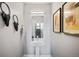 Modern powder room featuring stylish fixtures, decor, and a decorative mirror at 1930 Grove St # 2, Denver, CO 80204