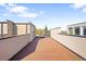 Expansive rooftop patio with wooden deck and surrounding walls, a perfect outdoor escape at 1930 Grove St # 2, Denver, CO 80204