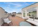 Relax on this outdoor rooftop patio featuring comfortable seating and a dining area at 1930 Grove St # 2, Denver, CO 80204