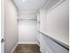 Walk-in closet with chrome hanging rods and shelving at 1930 Grove St # 2, Denver, CO 80204