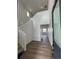 Inviting entryway with soaring ceilings, modern flooring, and a view of the staircase at 2142 S Irvington St, Aurora, CO 80018