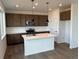 Modern kitchen featuring an island, stainless steel appliances, and stylish pendant lighting at 2142 S Irvington St, Aurora, CO 80018