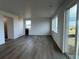 Bright living room with natural light, modern floors, and access to the backyard at 2142 S Irvington St, Aurora, CO 80018