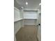 Walk-in closet with ample storage space and shelving for organization at 2142 S Irvington St, Aurora, CO 80018