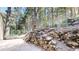 Exterior rock retaining wall and metal fence in the backyard at 30094 Upper Bear Creek Rd, Evergreen, CO 80439