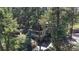 Charming cabin-style home nestled among tall pine trees, offering a secluded and serene retreat at 30094 Upper Bear Creek Rd, Evergreen, CO 80439