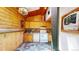 Rustic kitchen with vintage cabinets, brick accents, and modern appliances at 30094 Upper Bear Creek Rd, Evergreen, CO 80439