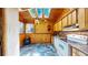 Charming kitchen featuring wood walls, skylights, and modern appliances for a bright, rustic feel at 30094 Upper Bear Creek Rd, Evergreen, CO 80439