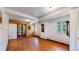 Spacious living room with wood floors, french doors and antique clocks at 30094 Upper Bear Creek Rd, Evergreen, CO 80439
