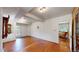 Open living room featuring hardwood floors, white walls and classic trim at 30094 Upper Bear Creek Rd, Evergreen, CO 80439