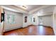 Bright living room with wood floors, white walls and classic trim at 30094 Upper Bear Creek Rd, Evergreen, CO 80439