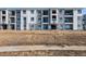 Apartment building exterior with balconies and landscaping at 6153 N Ceylon St # 306, Denver, CO 80249