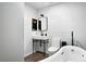Stylish bathroom with modern fixtures, wave-textured walls, and a sleek standalone tub at 960 N Pennsylvania St # 6, Denver, CO 80203