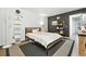 Well-lit bedroom featuring a modern bed frame, white shelves, and a striped rug at 960 N Pennsylvania St # 6, Denver, CO 80203