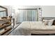 Comfortable bedroom with natural light, hardwood floors, soft textures, and modern furnishings at 960 N Pennsylvania St # 6, Denver, CO 80203