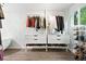 Organized closet space with tiered shelving for shoes, hanging rods, and drawer storage at 960 N Pennsylvania St # 6, Denver, CO 80203