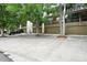 Modern townhome showcases an attached garage, mature trees and driveway parking near green foliage at 960 N Pennsylvania St # 6, Denver, CO 80203