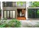 Inviting front entrance featuring a hanging swing chair and warm wood steps at 960 N Pennsylvania St # 6, Denver, CO 80203