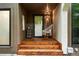Close-up of the front entrance with wooden steps and a hanging swing chair at 960 N Pennsylvania St # 6, Denver, CO 80203