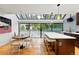 Bright kitchen with large skylight, island with breakfast bar, stainless steel appliances and hardwood floors at 960 N Pennsylvania St # 6, Denver, CO 80203