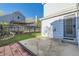 Backyard featuring a patio, grass, and wooden fence with brick trim at 11580 Depew Ct, Westminster, CO 80020
