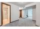 Partially finished basement with carpet, doorway, and full bath at 11580 Depew Ct, Westminster, CO 80020