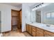 This bathroom boasts a large double sink vanity, a shower, and a spacious closet at 11580 Depew Ct, Westminster, CO 80020