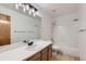 This bathroom is complete with a bath/shower combo and a double sink vanity at 11580 Depew Ct, Westminster, CO 80020