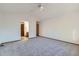 This primary bedroom includes neutral colored walls, carpet and a ceiling fan at 11580 Depew Ct, Westminster, CO 80020