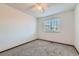 This cozy bedroom features neutral colored walls, carpet and a window at 11580 Depew Ct, Westminster, CO 80020