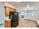 Open concept living room featuring hardwood floors, a fireplace, and natural light at 11580 Depew Ct, Westminster, CO 80020