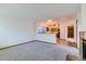 Spacious living room featuring carpeted floors and an open view into the kitchen at 11580 Depew Ct, Westminster, CO 80020