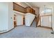 Bright living room with a staircase, high ceilings, and an open view of the kitchen at 11580 Depew Ct, Westminster, CO 80020