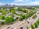 Overhead view of a residential area with mature trees, sidewalks, and easy access to nearby commercial areas at 8730 E Roundtree Ave, Greenwood Village, CO 80111