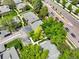 Aerial view highlighting the house surrounded by lush greenery and a well-maintained neighborhood at 8730 E Roundtree Ave, Greenwood Village, CO 80111