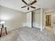 Bedroom featuring carpet floors, a closet and a side door access at 8730 E Roundtree Ave, Greenwood Village, CO 80111