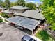 Aerial view of the parking area with multiple vehicles and greenery surrounding the homes at 8730 E Roundtree Ave, Greenwood Village, CO 80111
