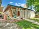 Charming home featuring a lush front yard with healthy lawn, walkway and inviting landscaping at 8730 E Roundtree Ave, Greenwood Village, CO 80111