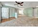 Inviting living room featuring carpet floors and a bright airy aesthetic at 8730 E Roundtree Ave, Greenwood Village, CO 80111