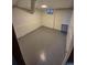 Basement room featuring a clean white interior and a painted gray floor at 588 Empire St, Aurora, CO 80010