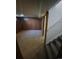 Basement room with wooden walls and carpeted floors at 588 Empire St, Aurora, CO 80010