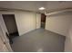 A basement room featuring a clean white interior and a painted gray floor at 588 Empire St, Aurora, CO 80010